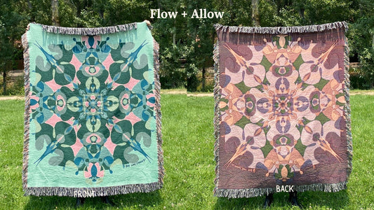 Front and back of a green and blue colorful kaleidoscope patterned woven blanket with the back more a pink and beige