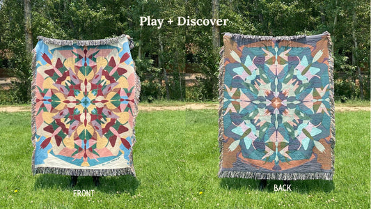 Front and back of a multi colored kaleidoscope patterned woven blanket with the back more blues and browns