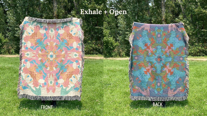 Front and back of a colorful kaleidoscope patterned woven blanket with the back more dark blue