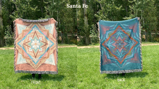 Front and back of a coral and green colorful mandala woven blanket with the back more dark blues