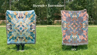 Front and back of a blue and yellow colorful kaleidoscope patterned woven blanket with the back more a pink and blue.