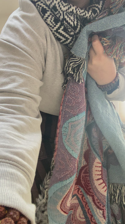 Mackenzie shows off a woven mandala blanket