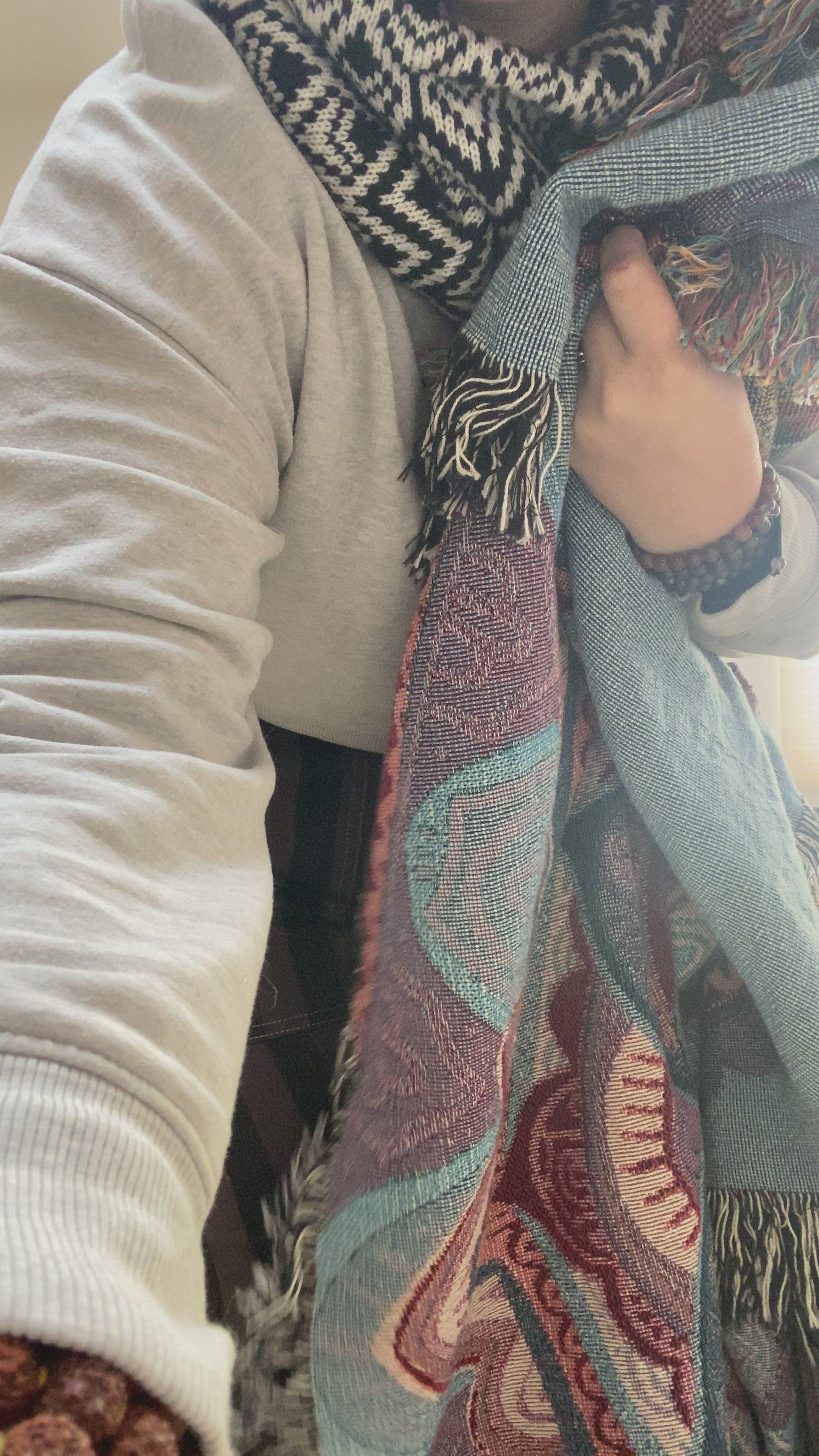 Mackenzie shows off a woven mandala blanket