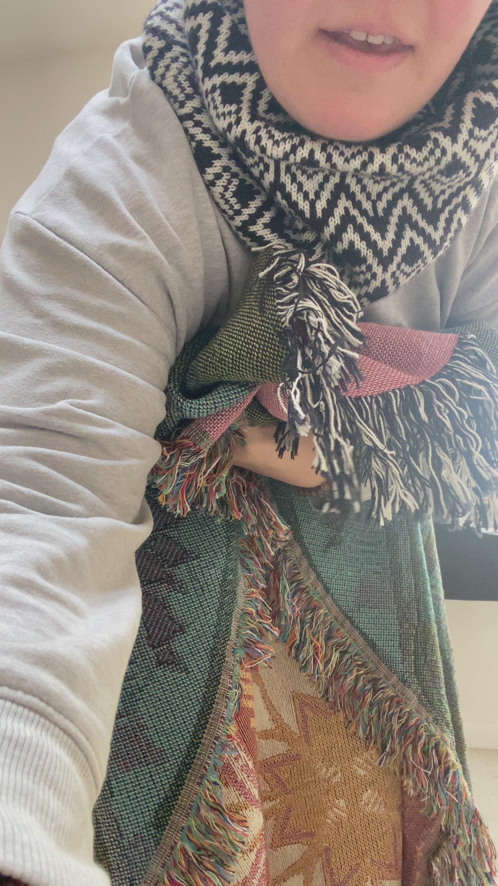 Video of Mackenzie showing woven blanket